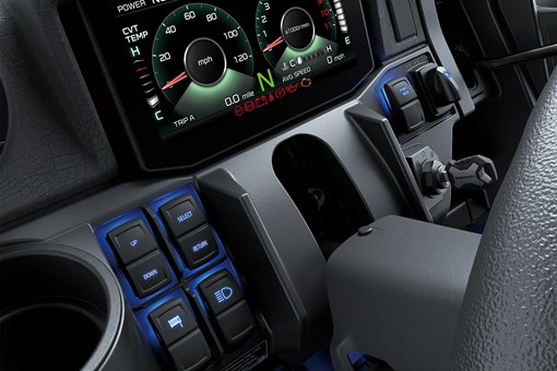 Close-up on a side x side infotainment screen and buttons. opens in a new window