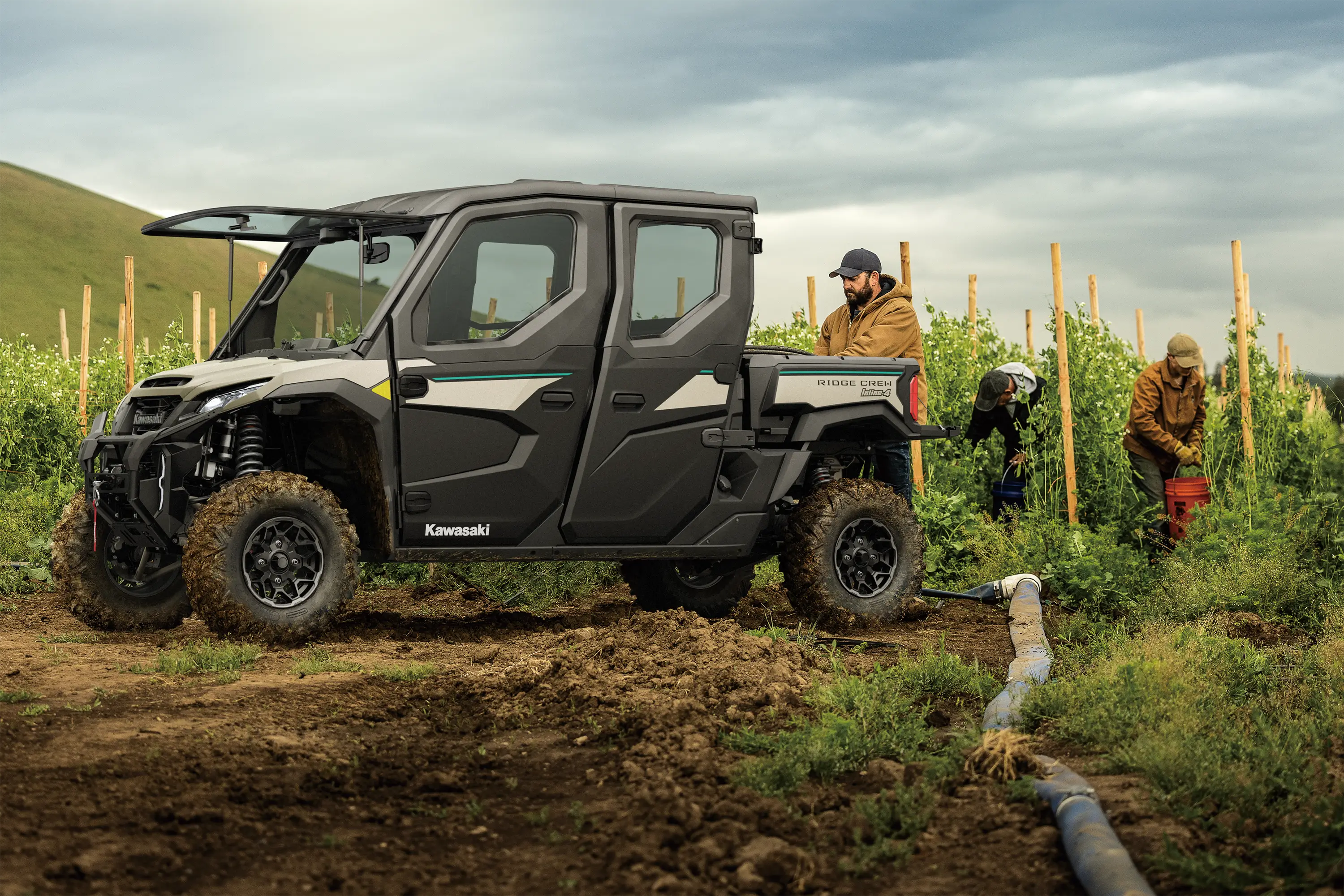 Three-quarter front angle of a side x side parked on a farm.