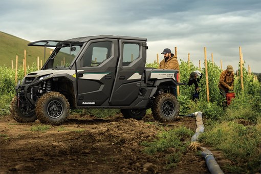 Three-quarter front angle of a side x side parked on a farm. opens in a new window