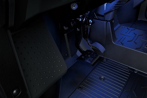 Side x side footwell in blue glow. opens in a new window