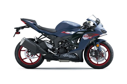 Profile angle of a blue motorcycle staged in a white studio background. opens in a new window
