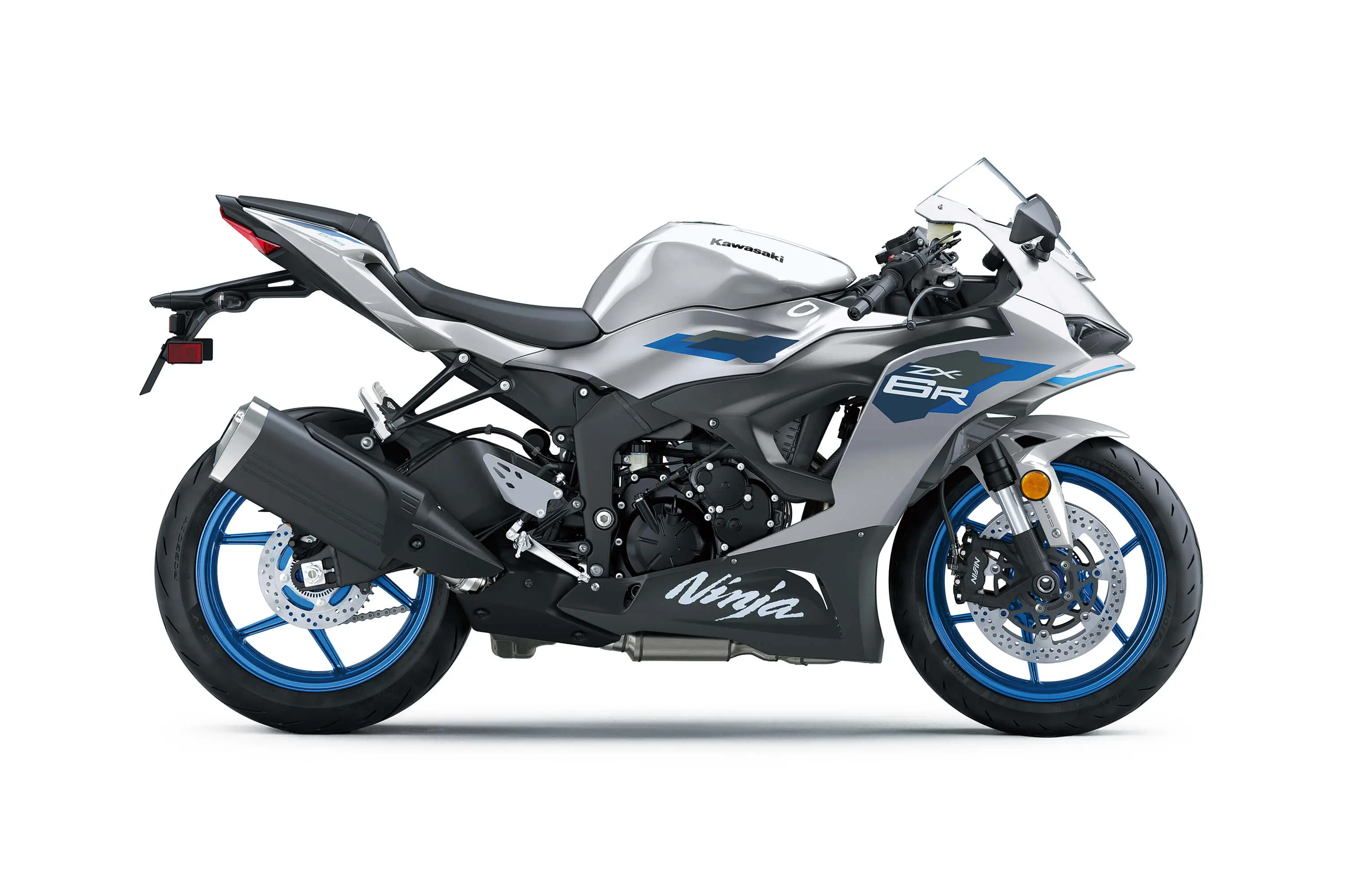 Side angle of a silver motorcycle staged in a white studio background.