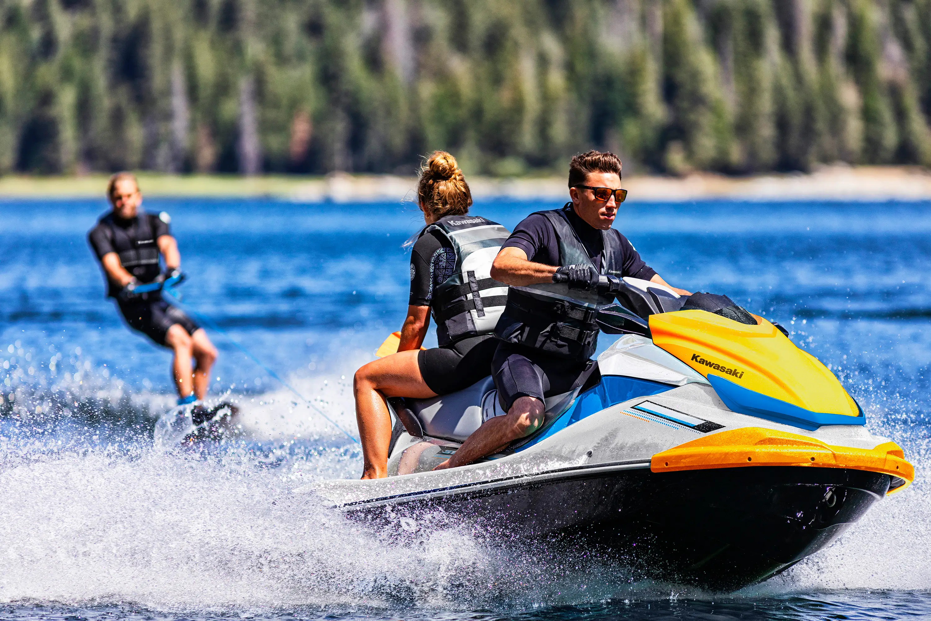 Person being towed behind a personal watercraft on the water.