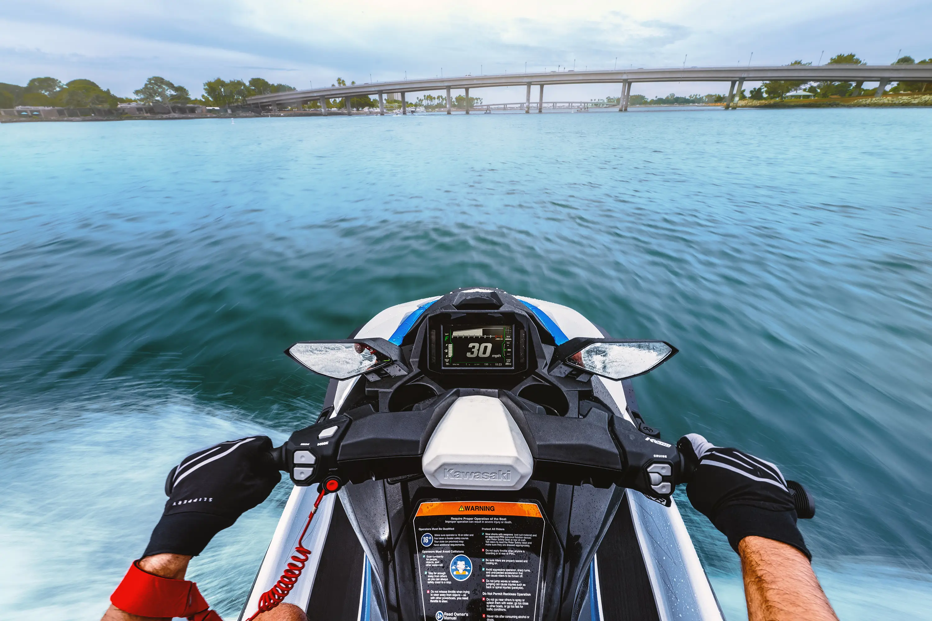 Rider POV of a personal watercraft on the water.