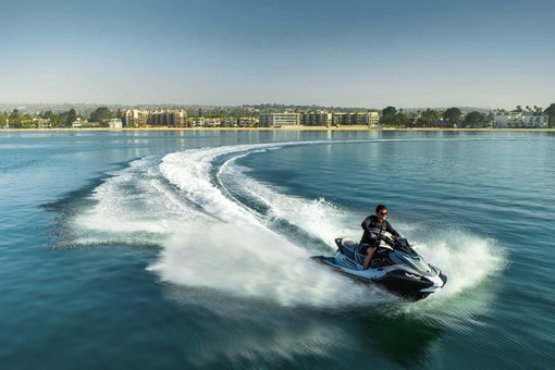 Overhead front angle of a person on a personal watercraft on the water. opens in a new window