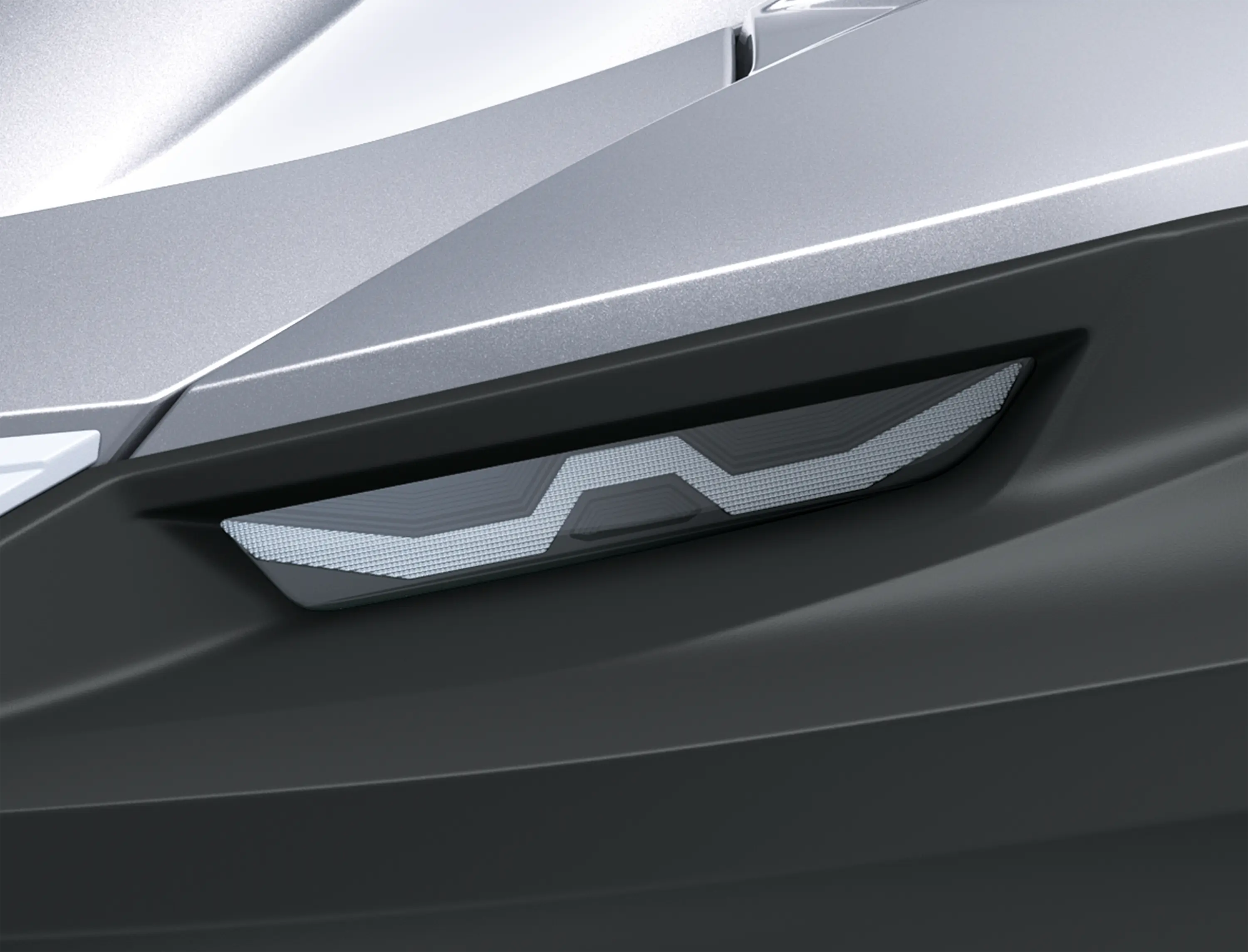 Closeup on headlight of a personal watercraft staged in a white studio background.