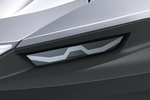 Closeup on headlight of a personal watercraft staged in a white studio background. opens in a new window