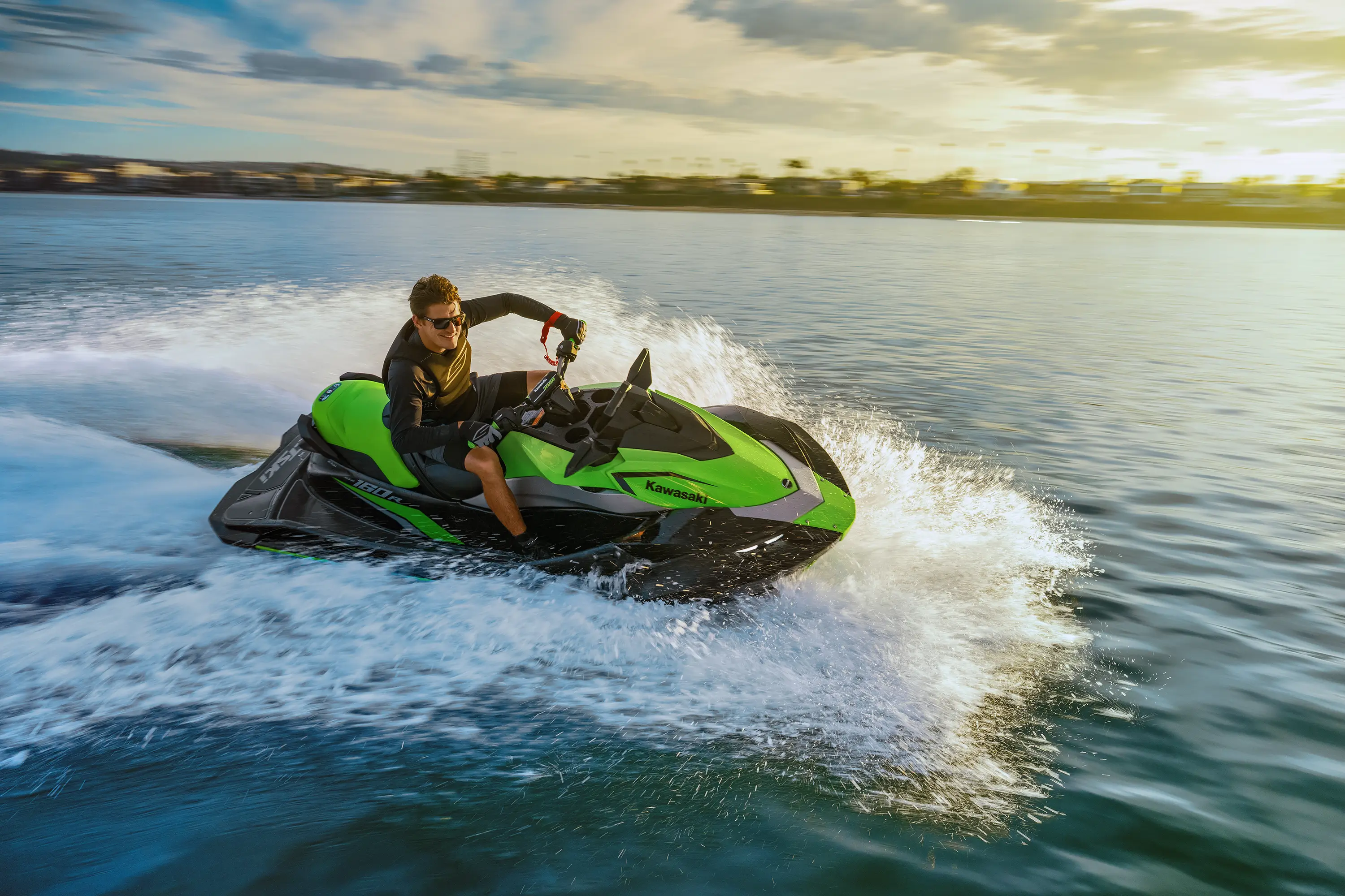 Person turning a watercraft on the water.