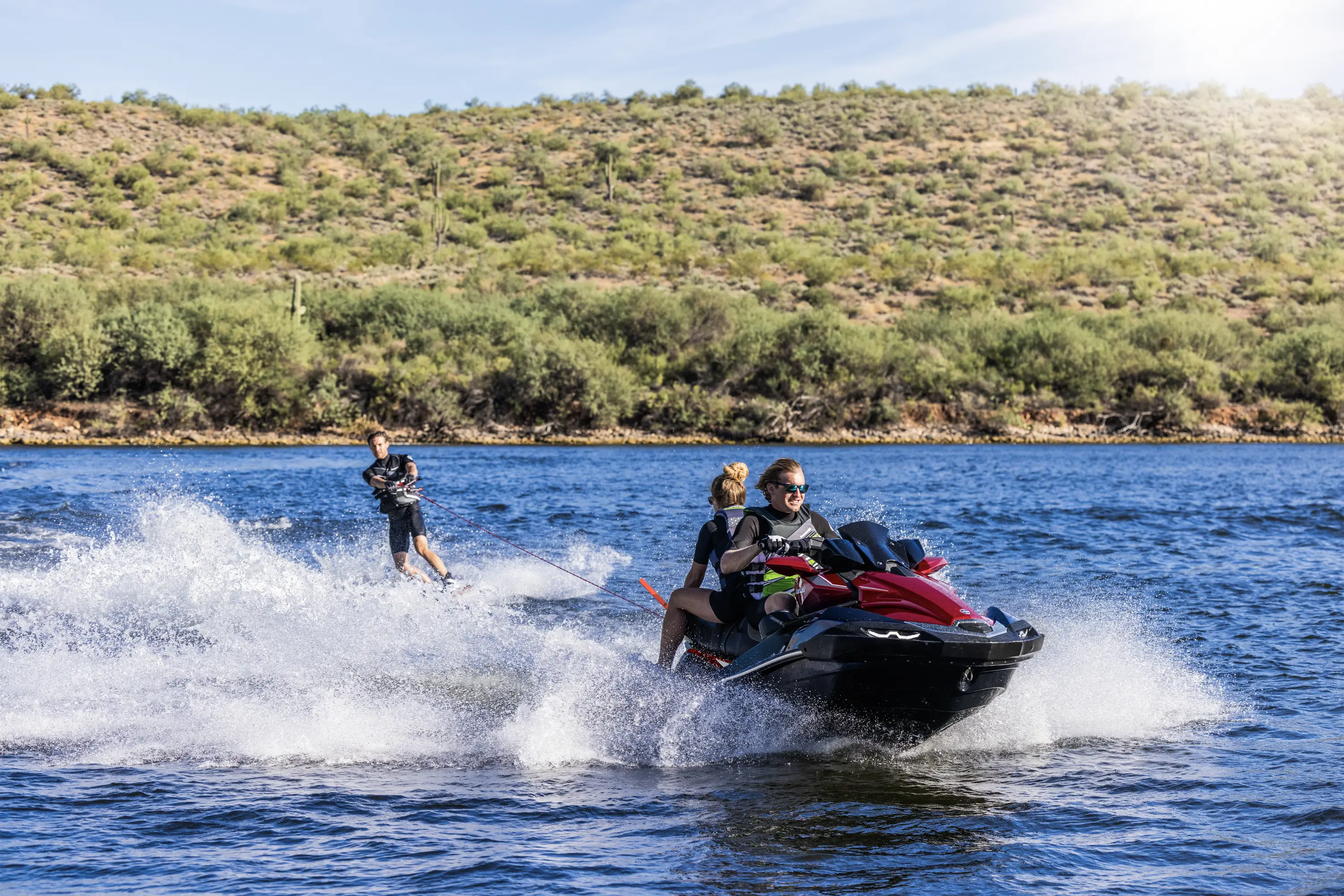 A person being towed behind a personal watercraft on the water.