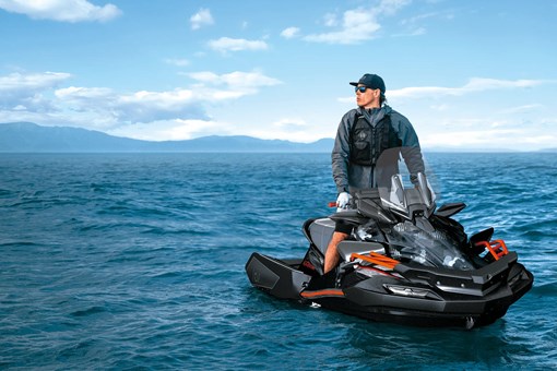 Person sitting on a personal watercraft on the water. opens in a new window