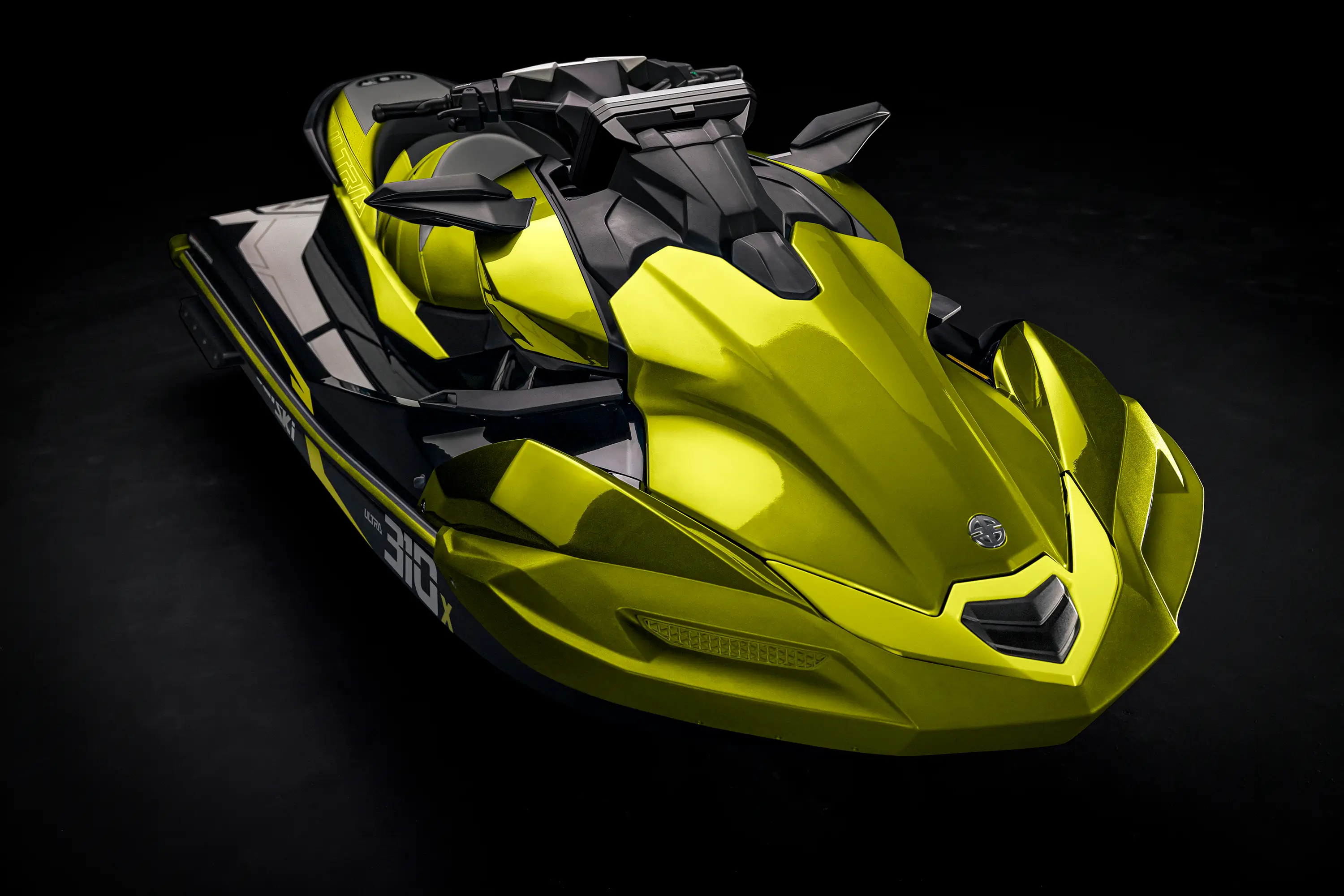 Overhead three-quarter front angle of a personal watercraft staged in a black studio background.
