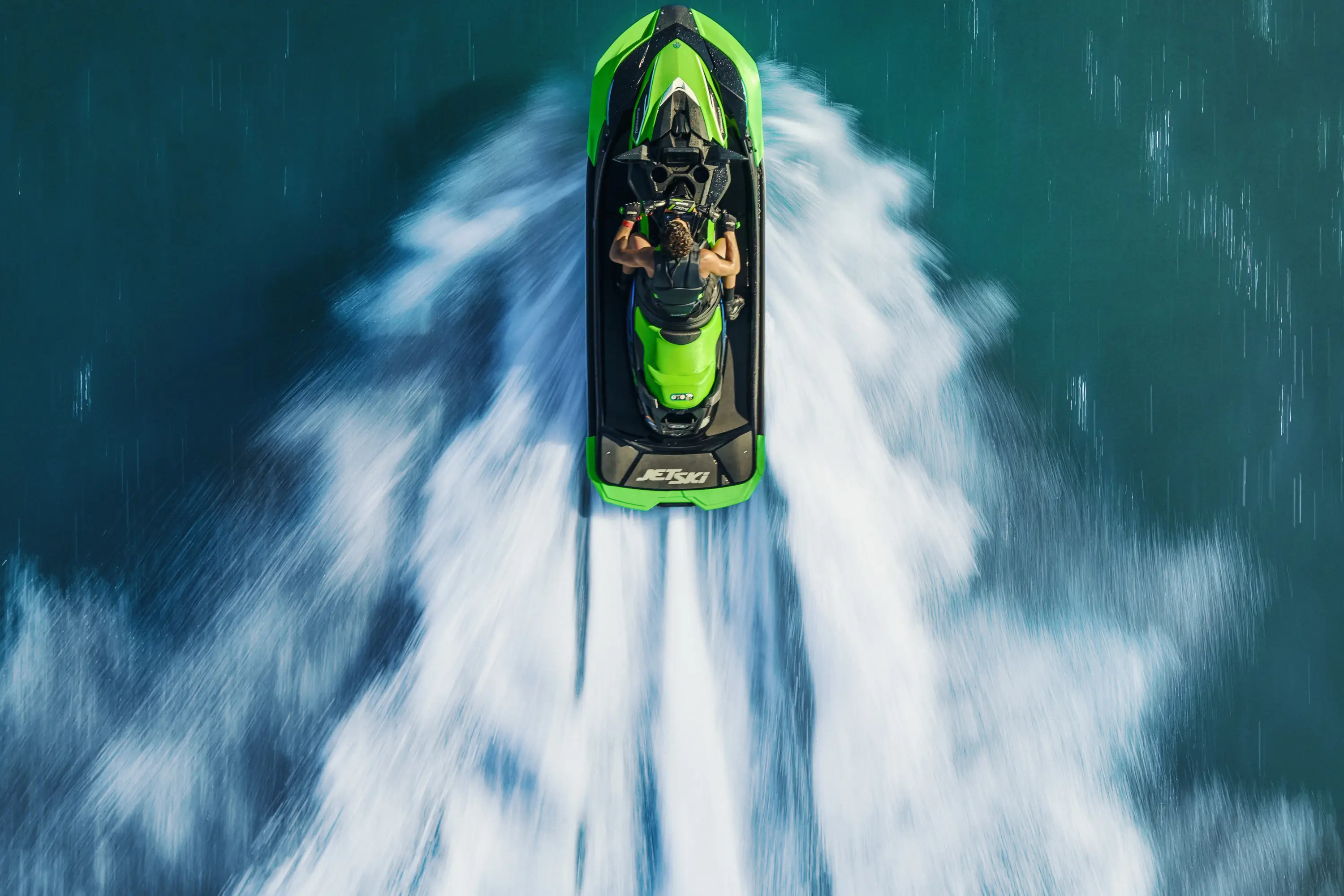 Overhead shot of a person on a personal watercraft.