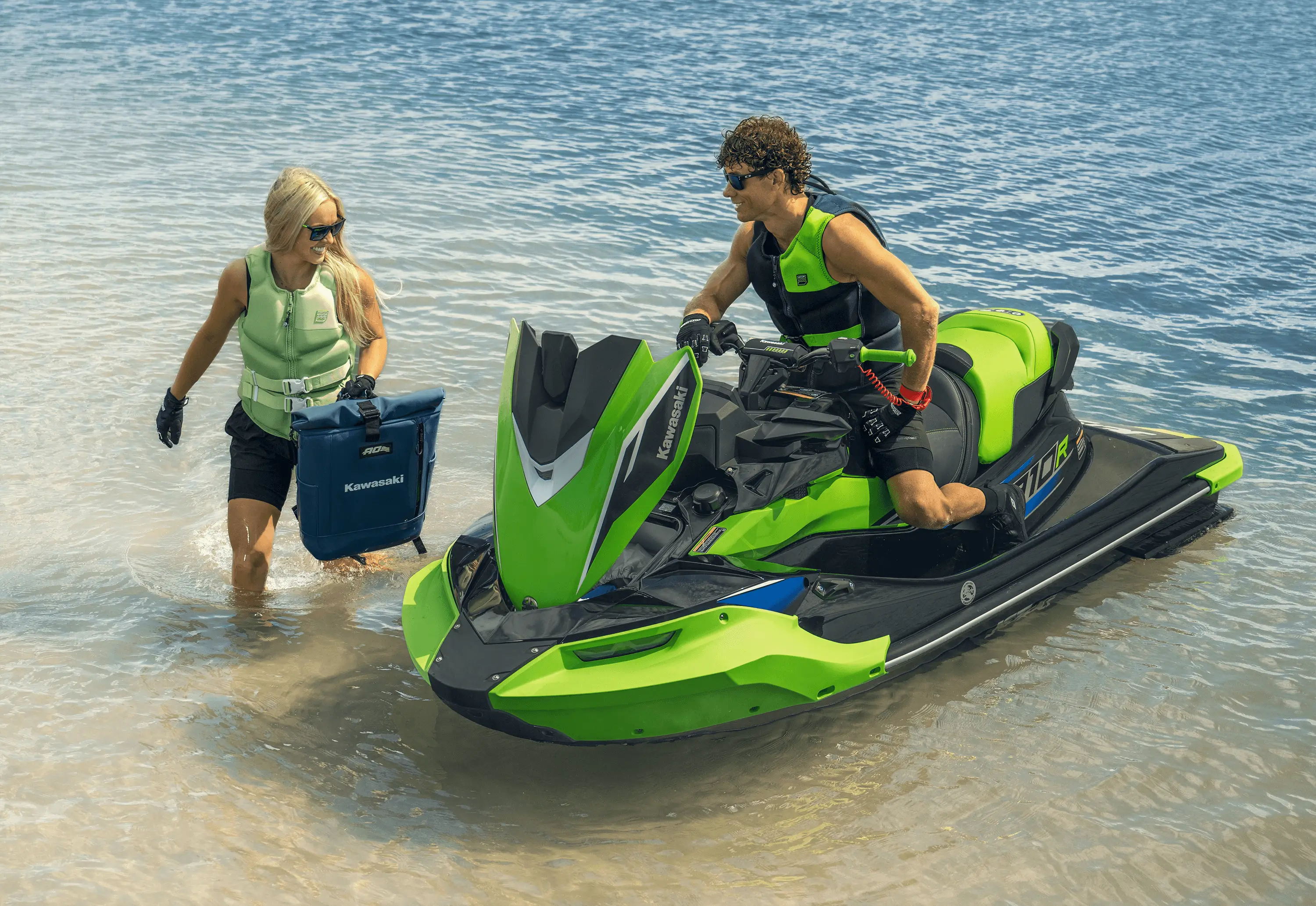 Two people finishing a day on the water parked at the shoreline.