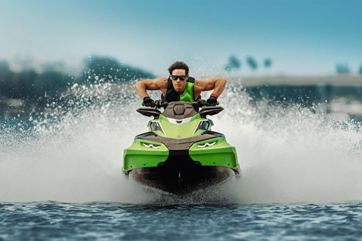 Close front angle of a person on a personal watercraft on the water. opens in a new window
