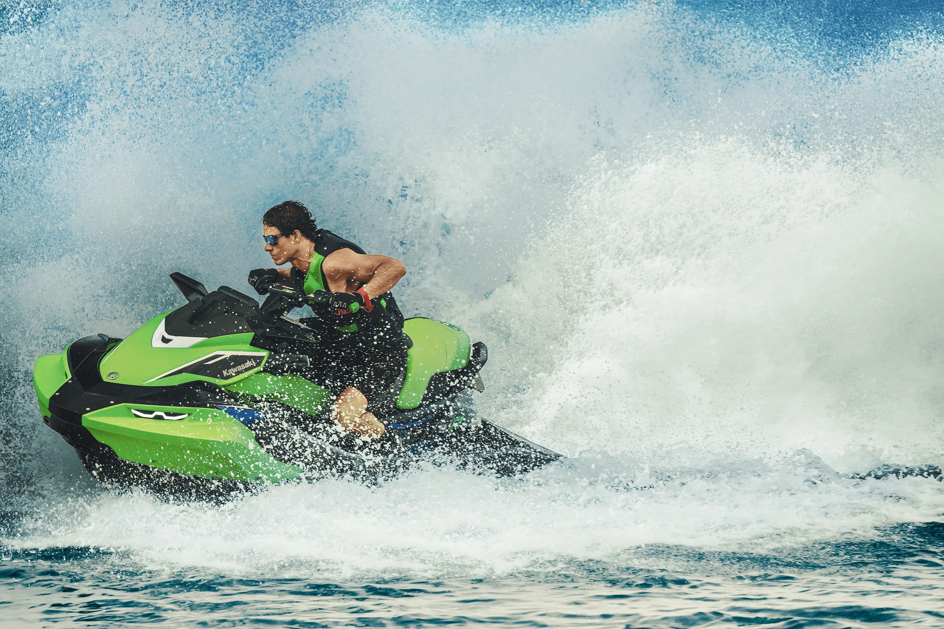 Person creating waves on a personal watercraft.