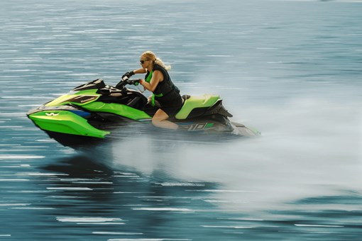 Profile angle of a person on a personal watercraft on the water. opens in a new window