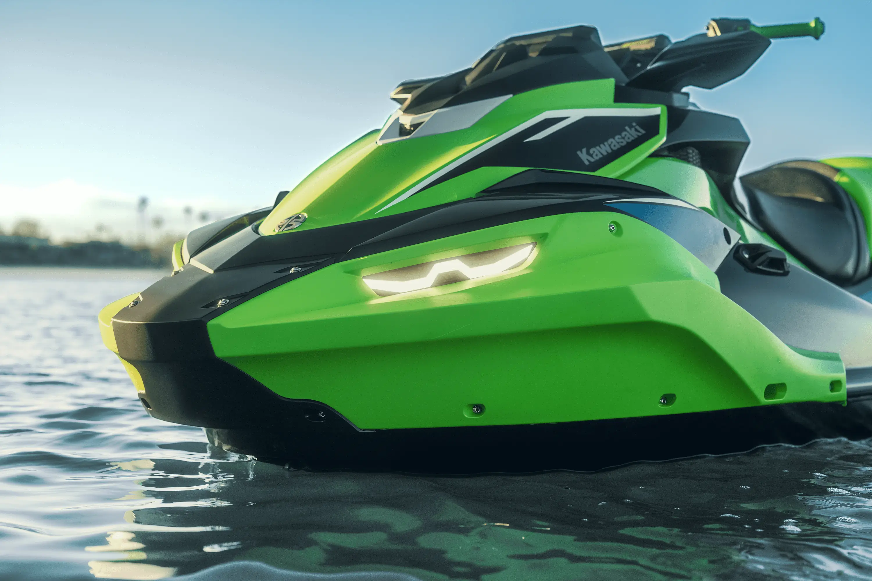 Three-quarter front detail angle of a watercraft on the water.