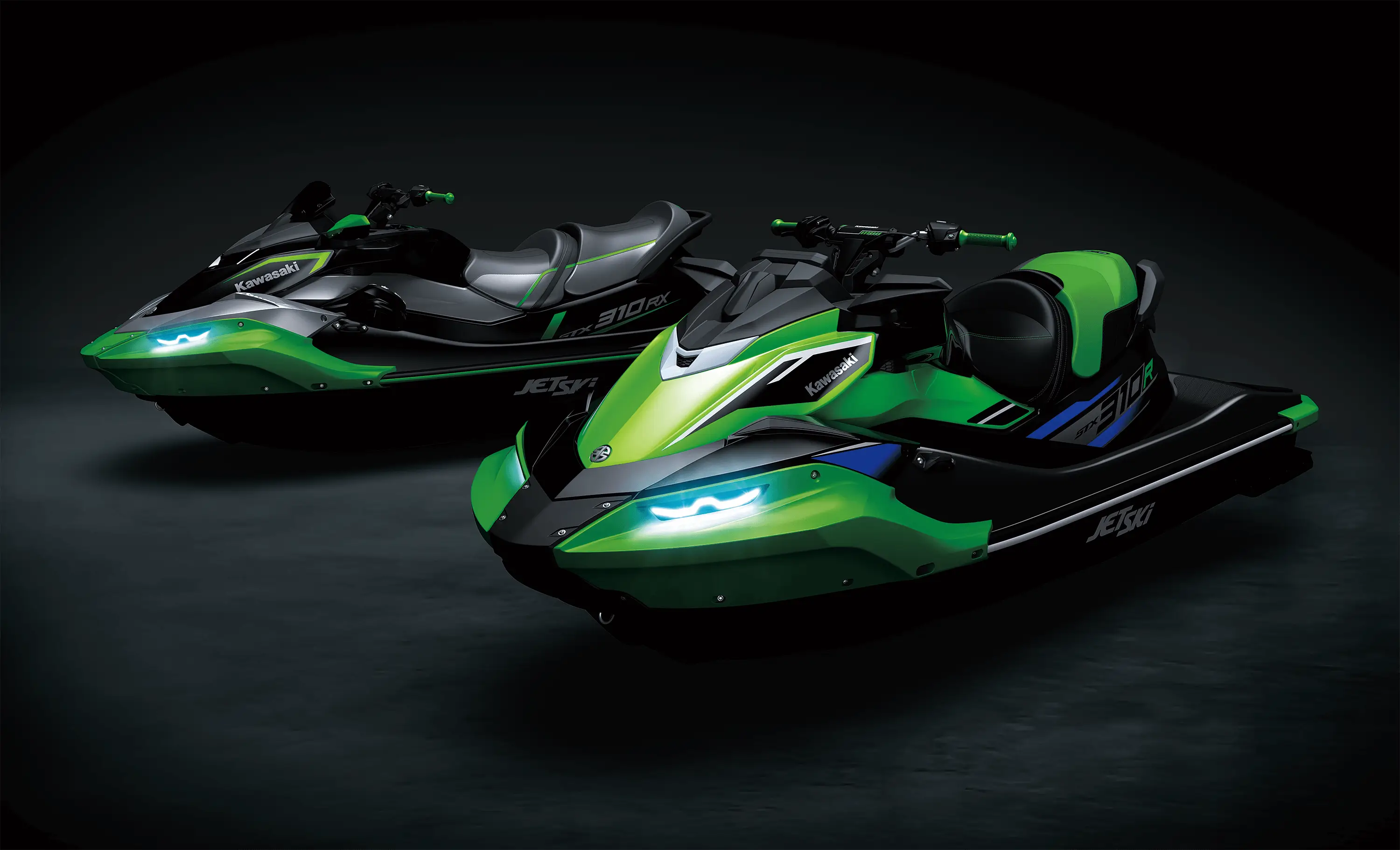 Three-quarter front angle of two personal watercraft staged in a black studio background.