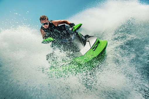 Front angle of a person on a personal watercraft on the water. opens in a new window