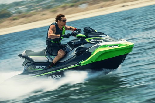 Profile angle of a person on a personal watercraft on the water. opens in a new window