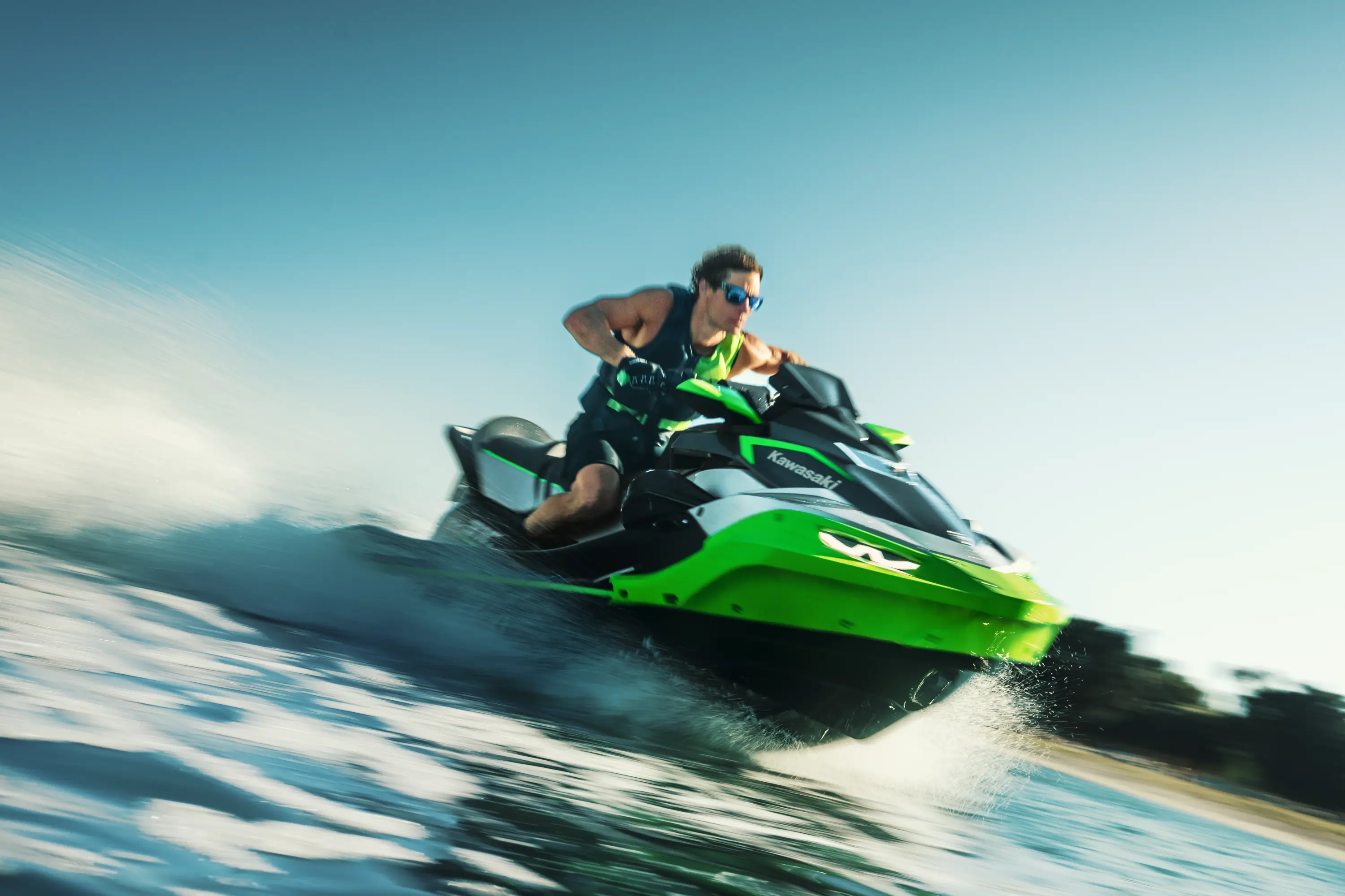 Water level shot of person on a personal watercraft.