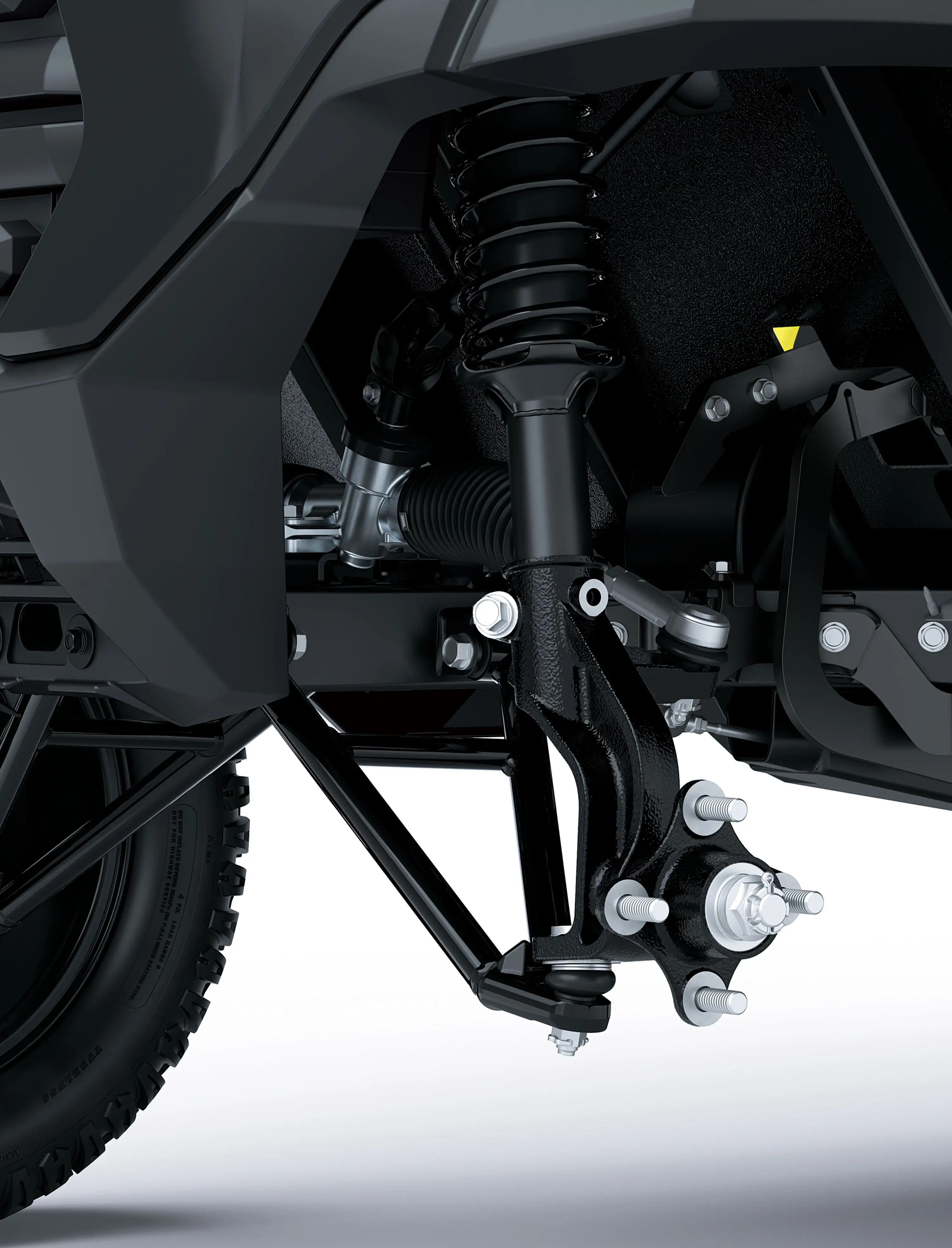 Suspension detail of a Neighborhood Activity Vehicle in a white studio background.