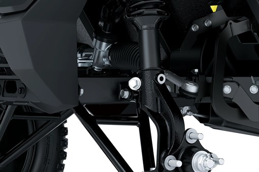 Suspension detail of a Neighborhood Activity Vehicle in a white studio background. opens in a new window
