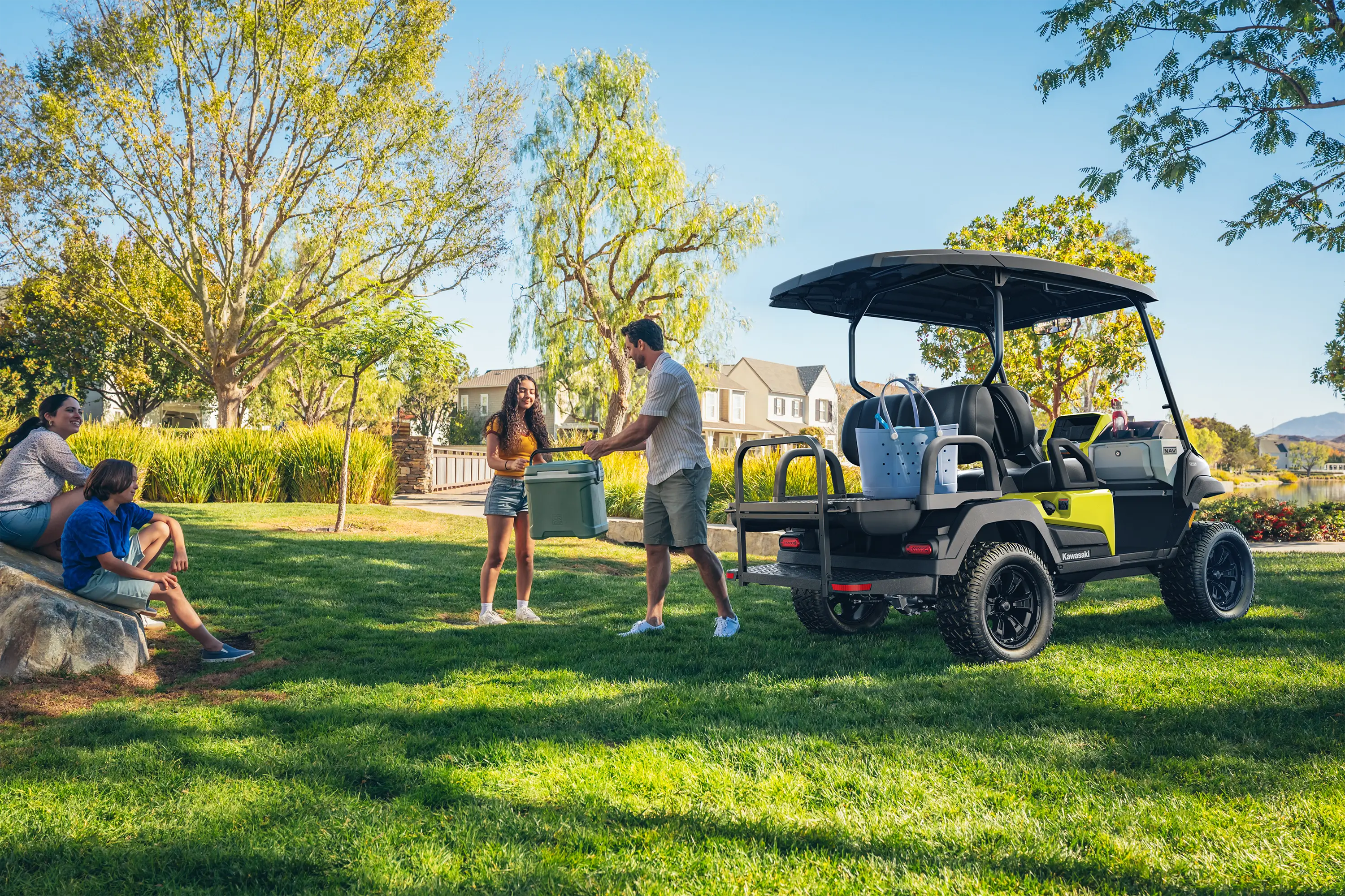 Three-quarter rear angle of a Neighborhood Activity Vehicle parked on grass.