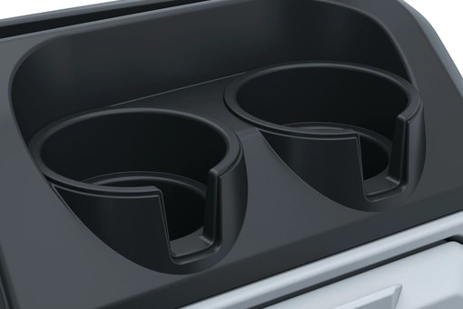 Cup holders in a Neighborhood Activity Vehicle in a white studio background. opens in a new window