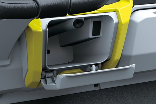 Storage in center of dash of a Neighborhood Activity Vehicle in a white studio background. opens in a new window