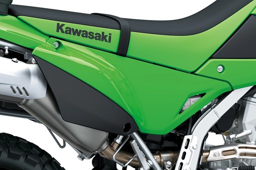 Side of seat of a motorcycle staged in a white studio background. opens in a new window