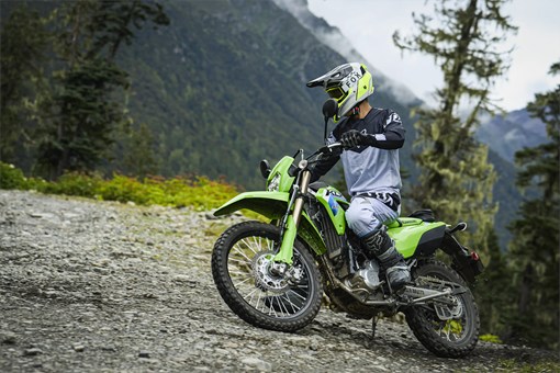 Side angle of a person riding a motorcycle off-road. opens in a new window