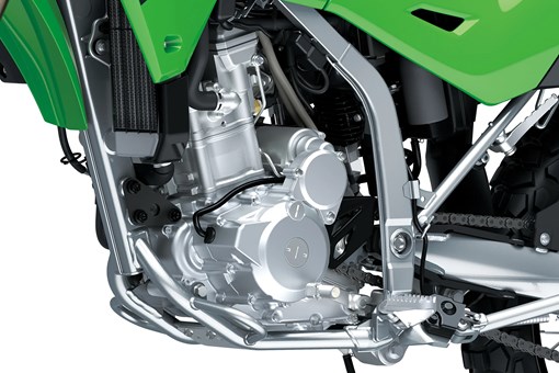 Engine of a motorcycle staged in a white studio background. opens in a new window