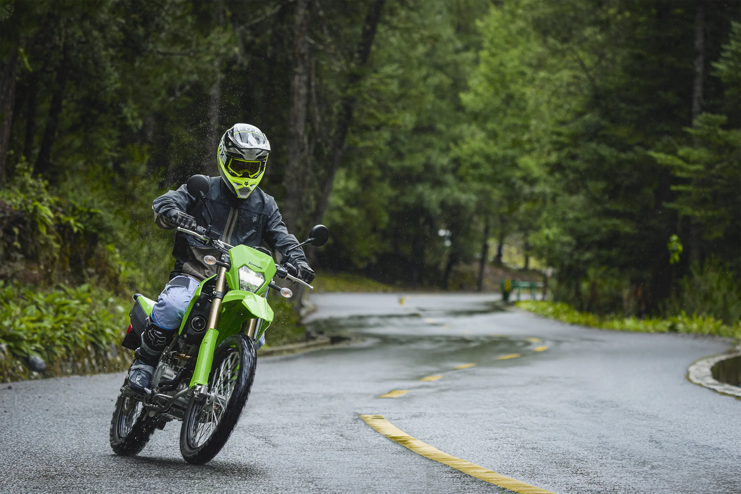 Front angle of a person riding a motorcycle on a highway.