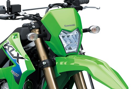 Nose closeup of a motorcycle staged in a white studio background. opens in a new window