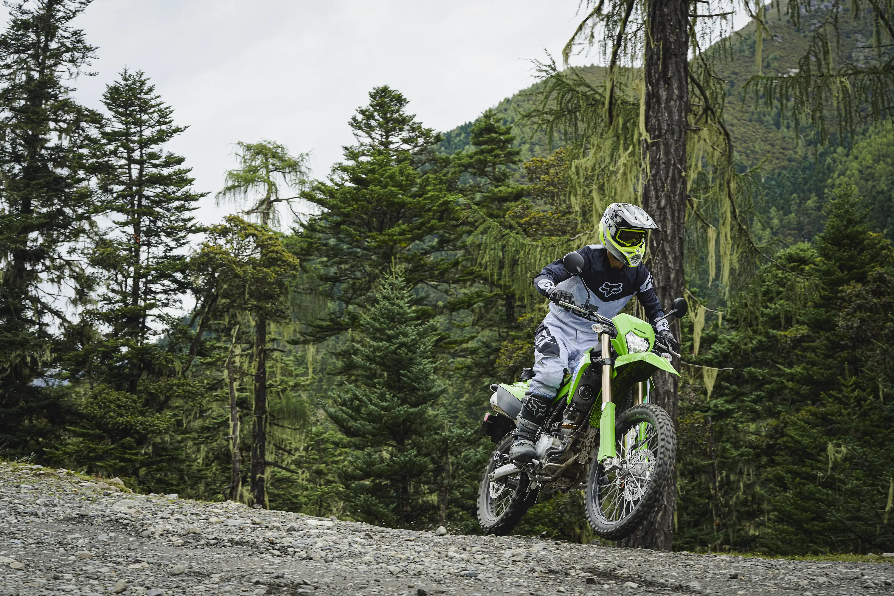 Front angle of a person riding a motorcycle off-road.