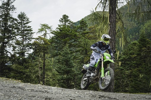 Front angle of a person riding a motorcycle off-road. opens in a new window
