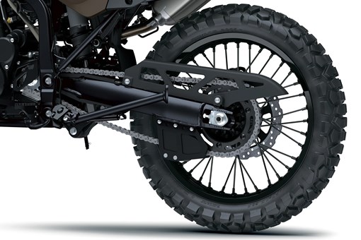 Rear wheel of a motorcycle staged in a white studio background. opens in a new window
