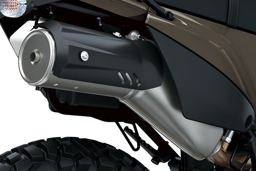 Exhaust of a motorcycle staged in a white studio background. opens in a new window