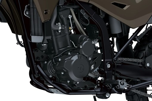 Engine of a motorcycle staged in a white studio background. opens in a new window