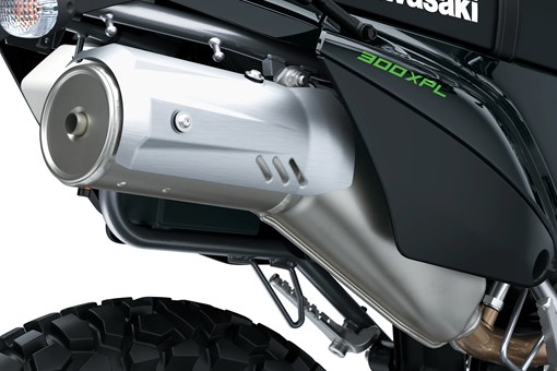 Exhaust of a motorcycle staged in a white studio background. opens in a new window