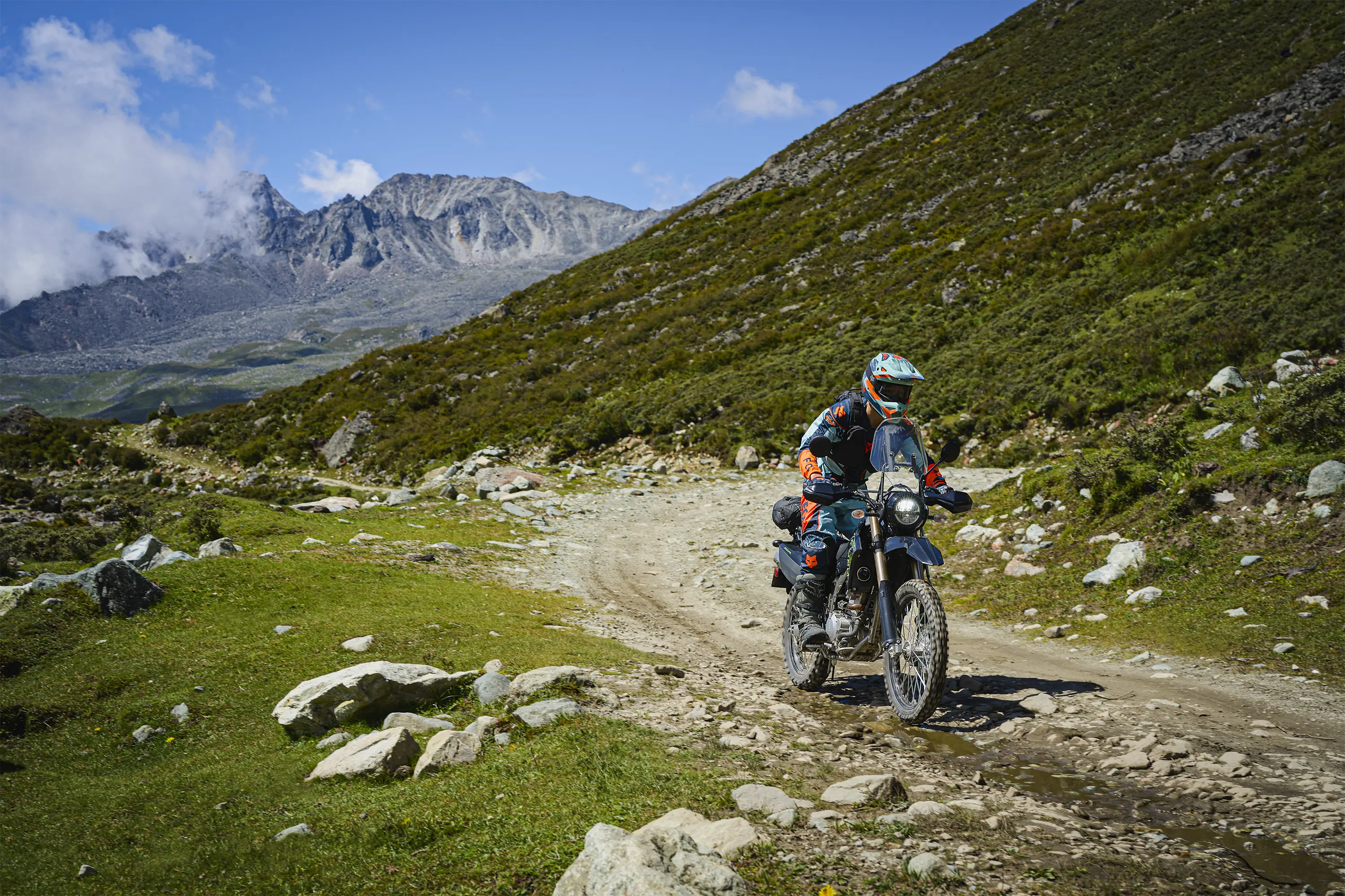Front angle of a person riding a motorcycle off-road.