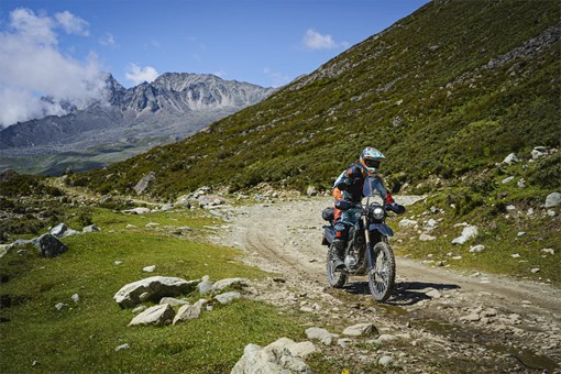 Front angle of a person riding a motorcycle off-road. opens in a new window