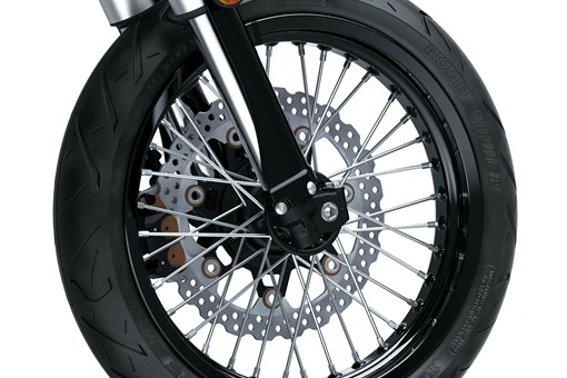 Front wheel of a motorcycle staged in a white studio background. opens in a new window