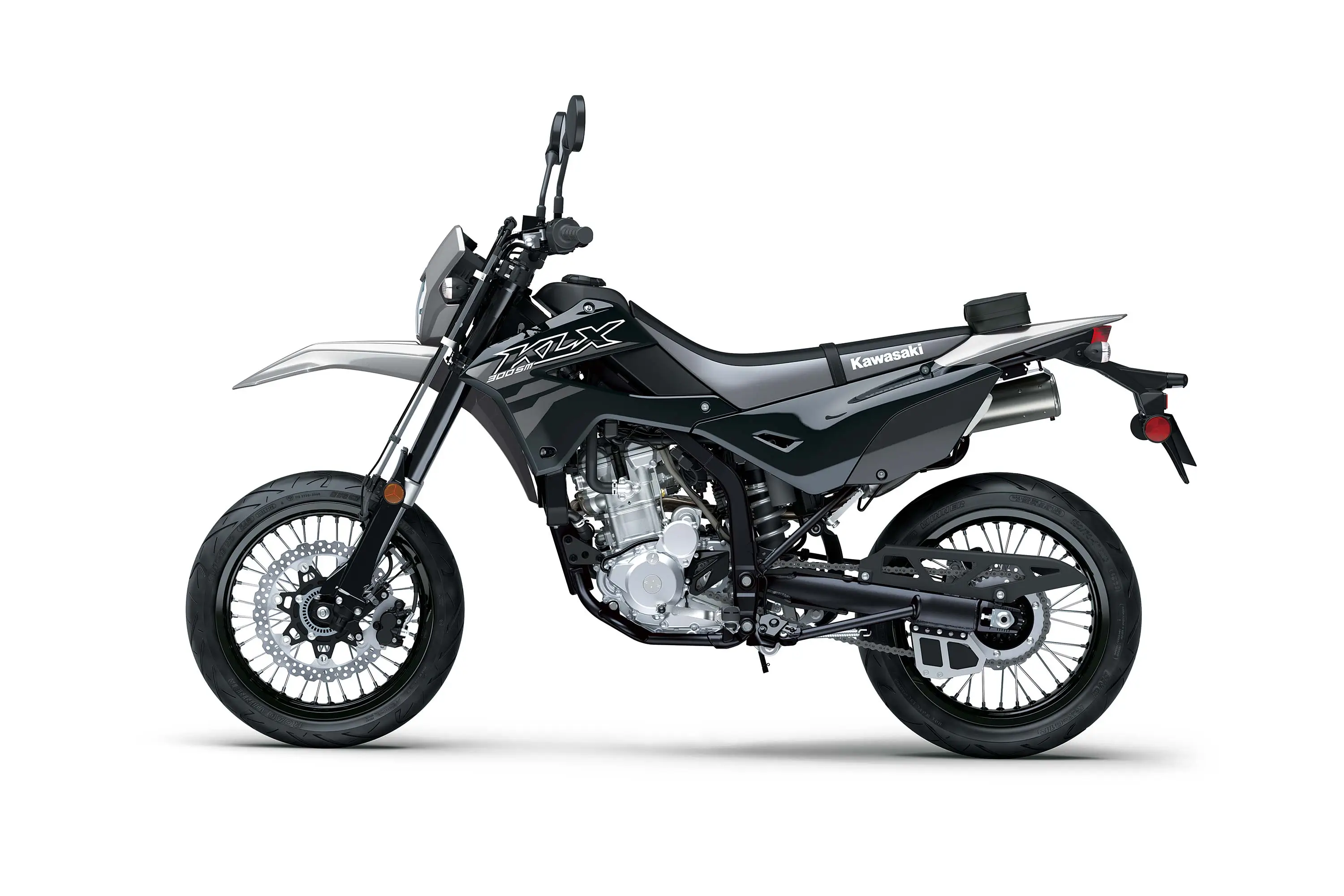 Side angle of a grey motorcycle staged in a white studio background.