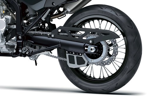 Rear wheel of a motorcycle staged in a white studio background. opens in a new window