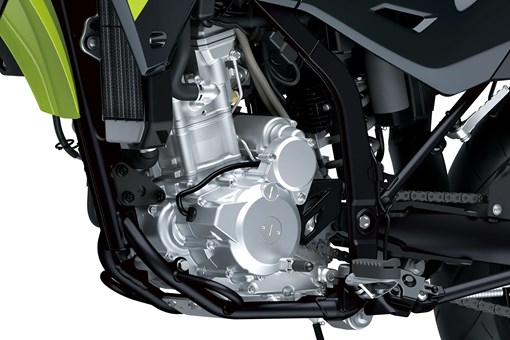 Engine of a motorcycle staged in a white studio background. opens in a new window