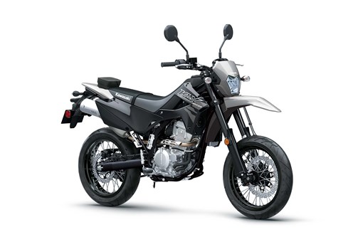 Three-quarter front angle of a grey motorcycle staged in a white studio background. opens in a new window