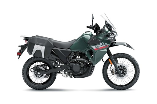 Profile angle of a green motorcycle staged in a white studio background. opens in a new window