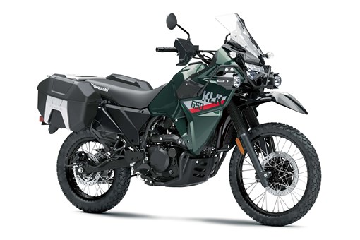 Three-quarter front angle of a green motorcycle staged in a white studio background. opens in a new window